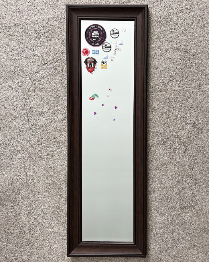 Full length framed mirror with stickers on it before makeover
