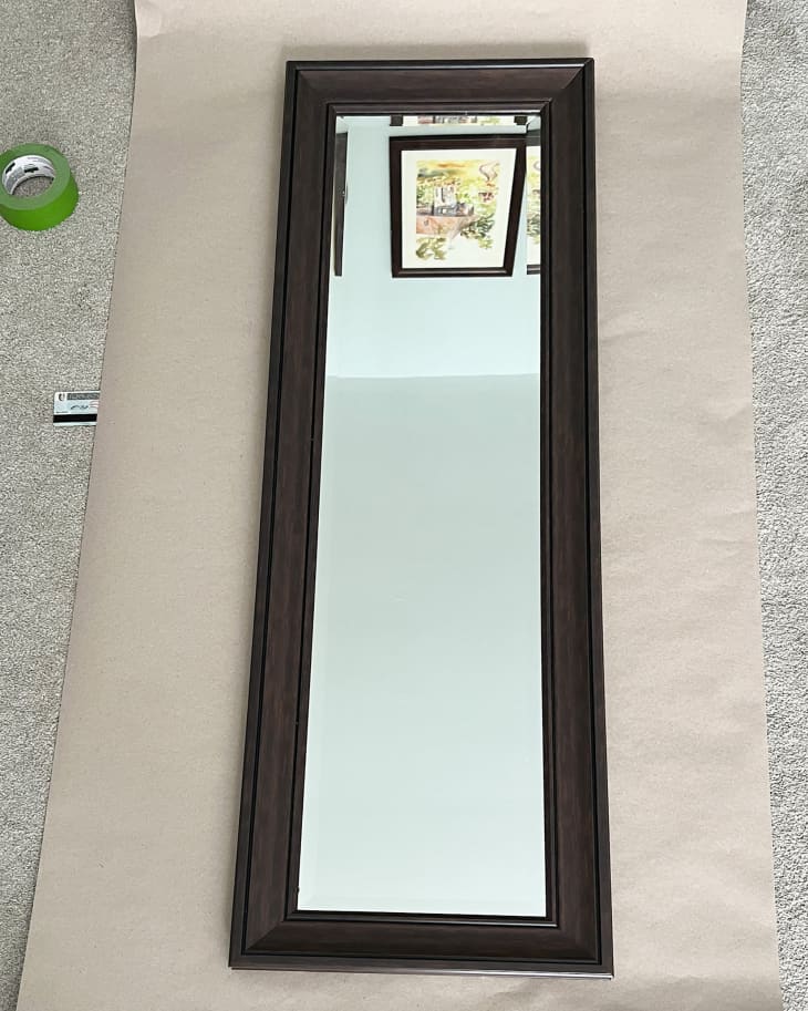 full-length framed mirror after stickers have been removed