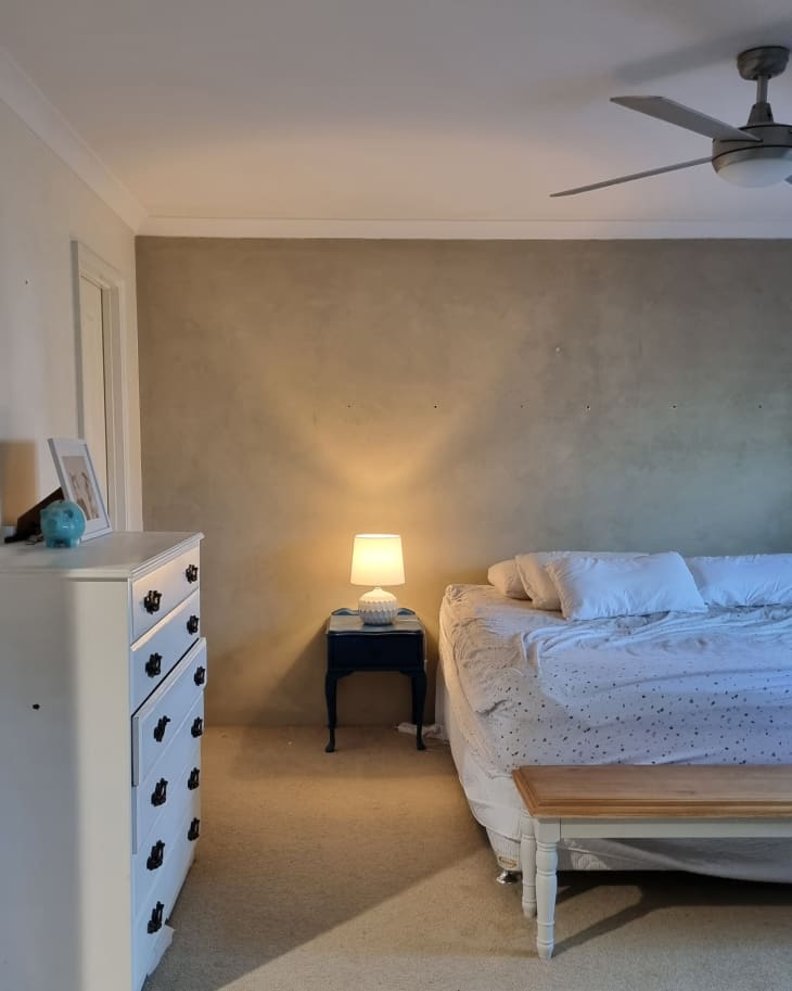 greige bedroom with beige carpet before makeover