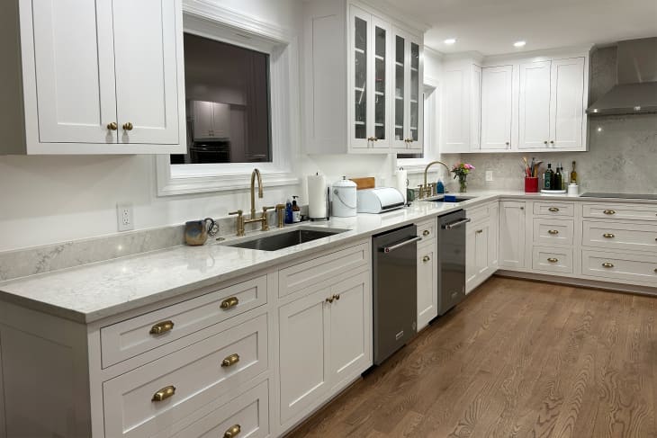 White marble countertops in newly renovated kitchen.