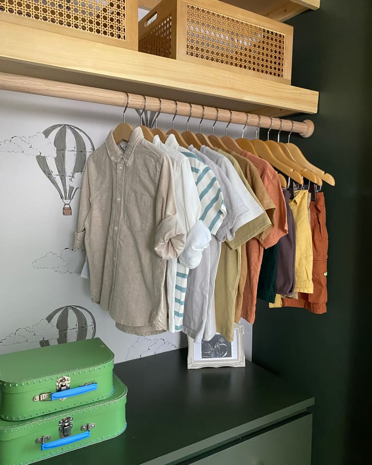 Children's clothing hung in closet.