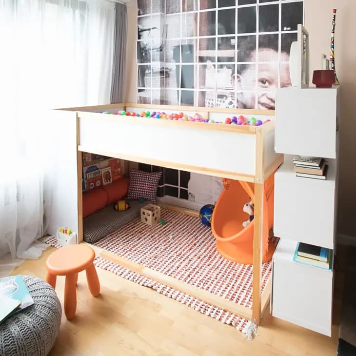 Ball pit on the top of bunk bed in kids room.