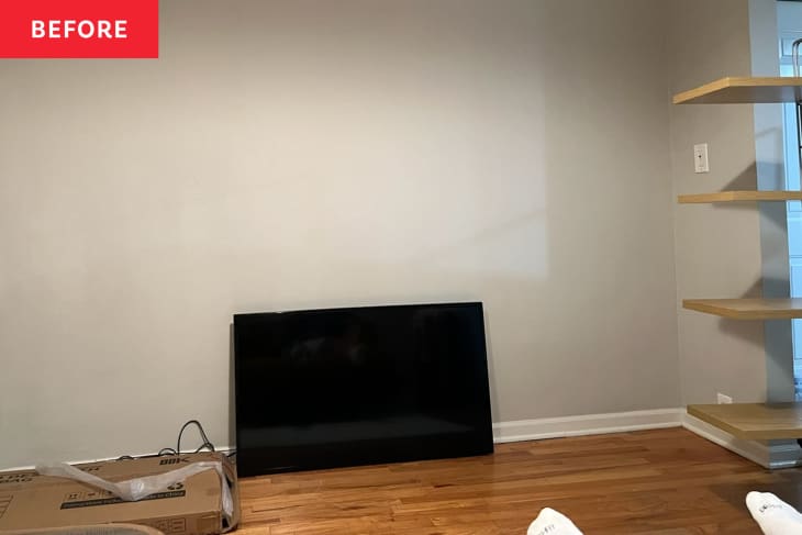 Empty beige wall before DIYing floating console and hanging television.