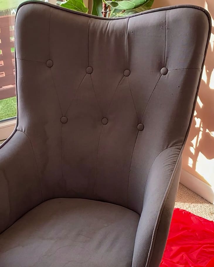 Dingy grey armchair before painting.
