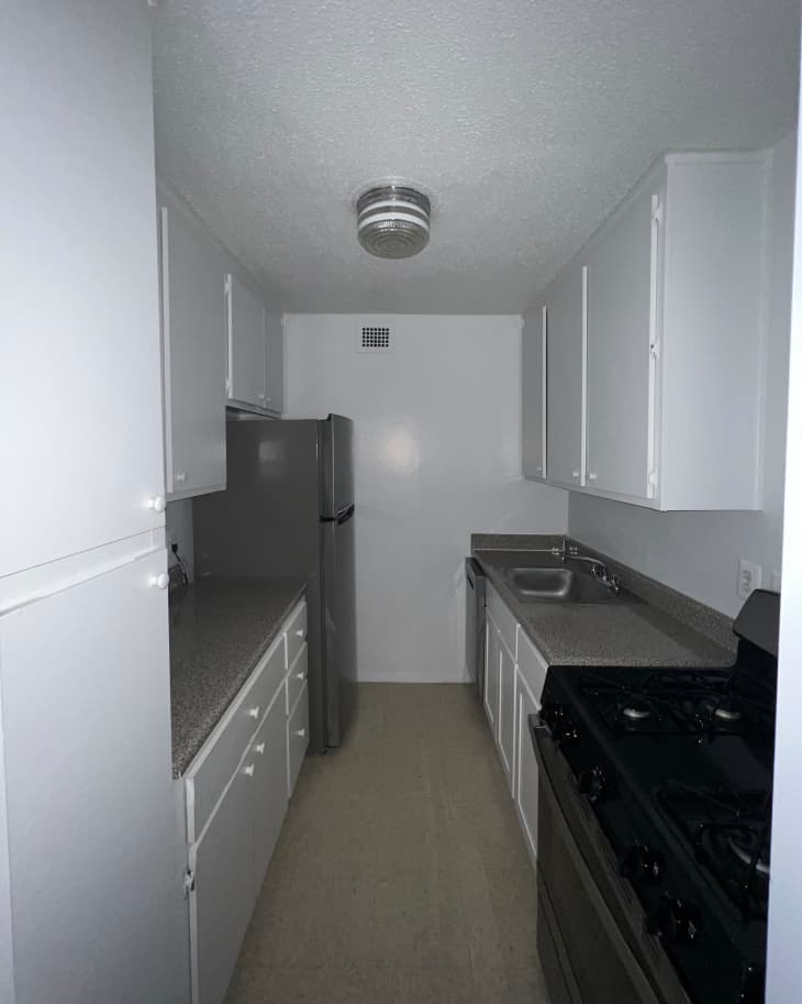 White kitchen before renovation.