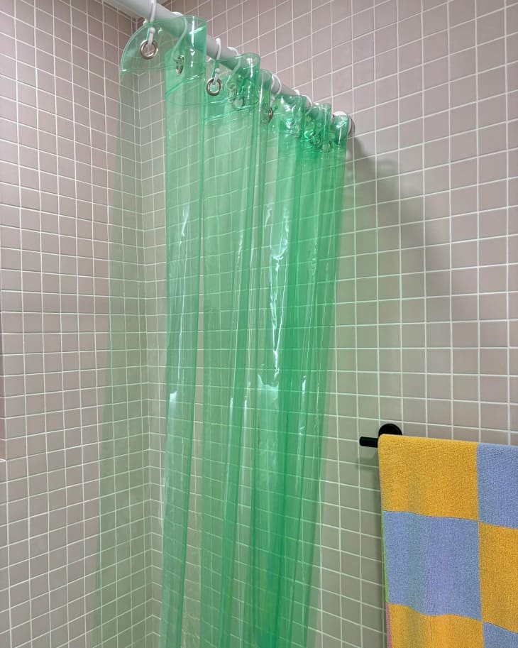 Colorful shower curtain in newly renovated bathroom.