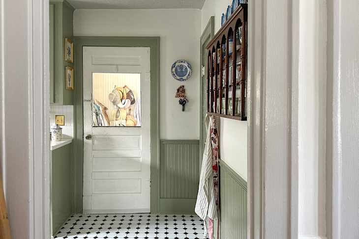 Green painted wainscoting and trim.