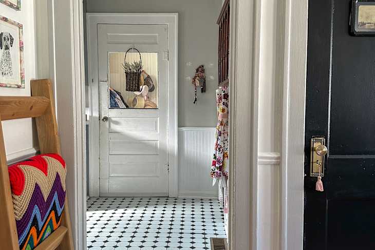 White door, trim and wainscoting in kitchen before renovation.