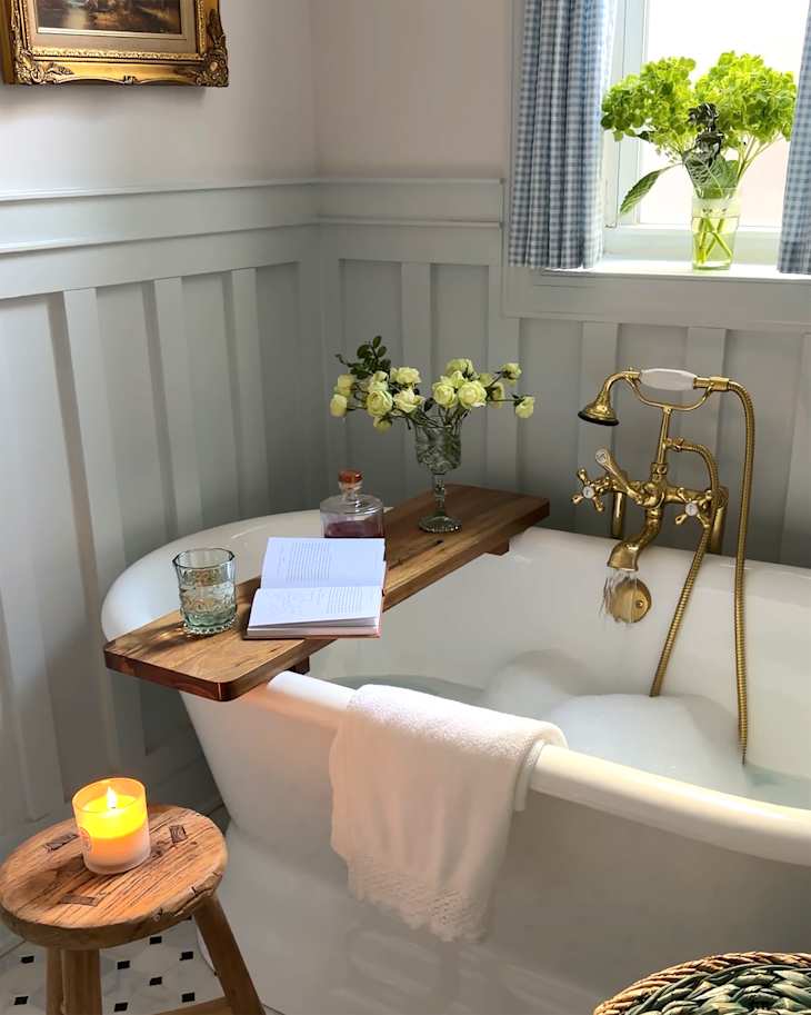 Newly installed bathtub in renovated bathroom.