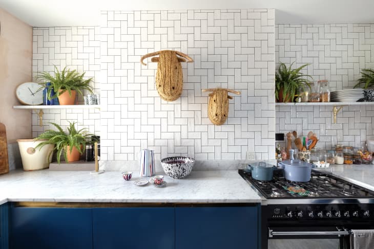 Kitchen Utensils With Stove On Wooden Countertop And White Tiled