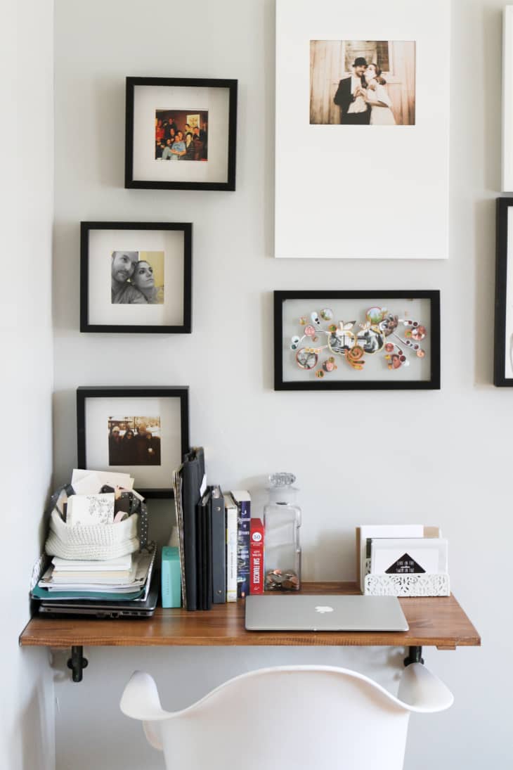 a small floating desk is installed with black piping underneath
