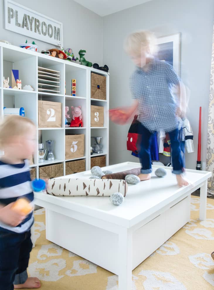 Two kids playing in their playroom