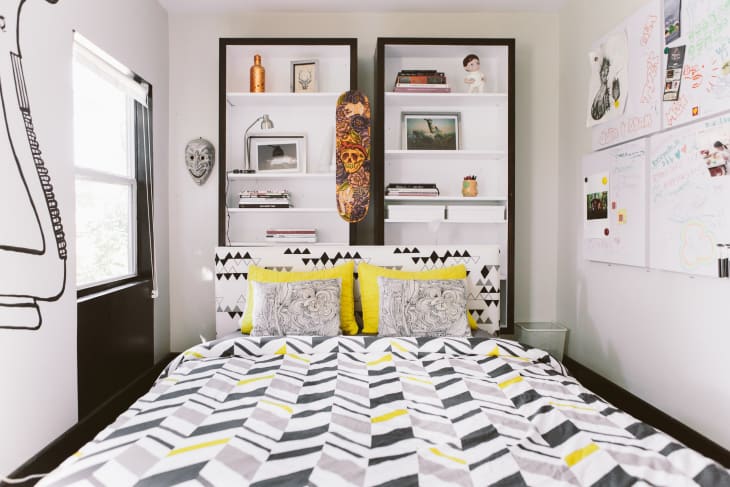 tall storage cabinets behind bed