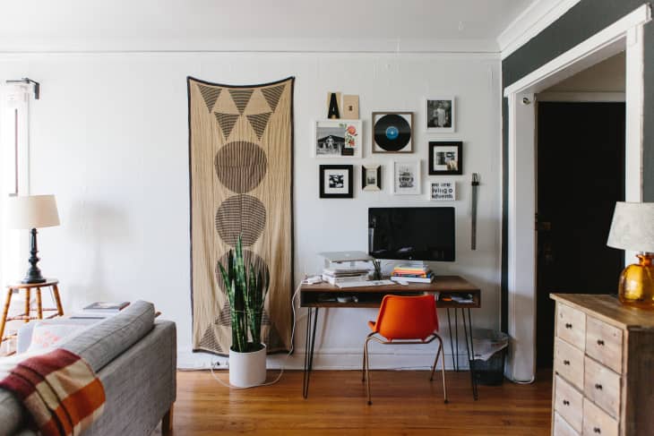 An office and living room combined in the same space