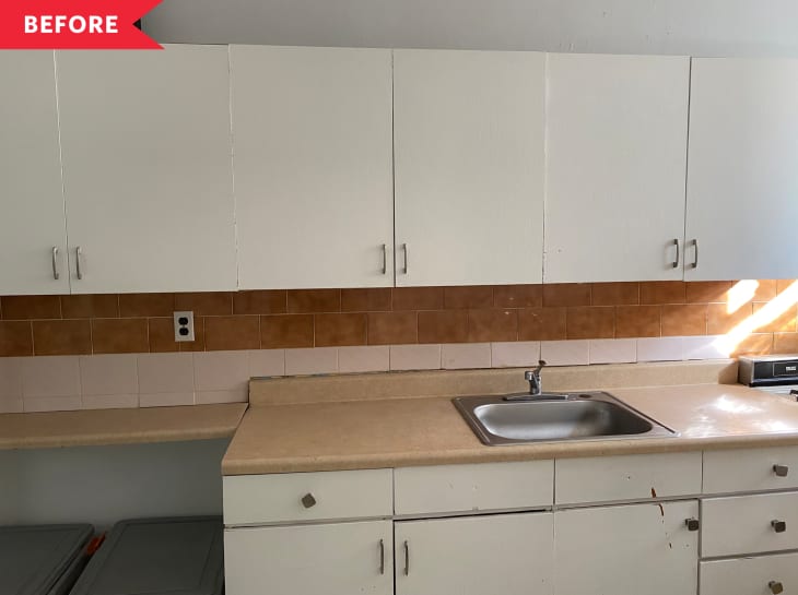 Before: simple kitchen with white cabinets and brick-colored tile