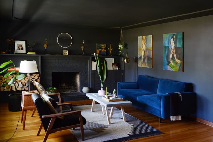 Dark living room with black walls and black ceiling