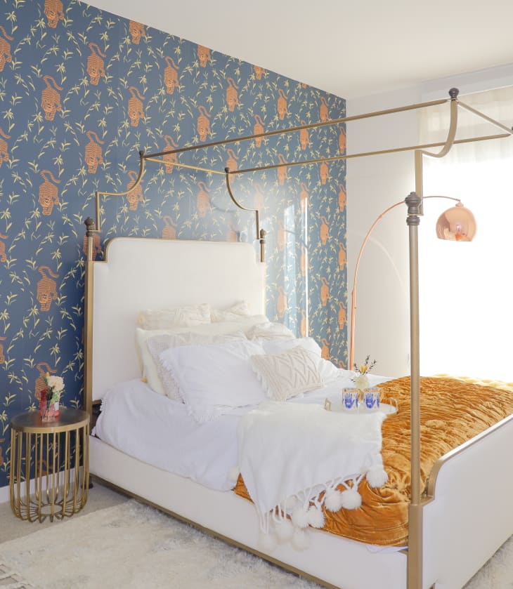 Bedroom with blue and copper tiger wallpaper