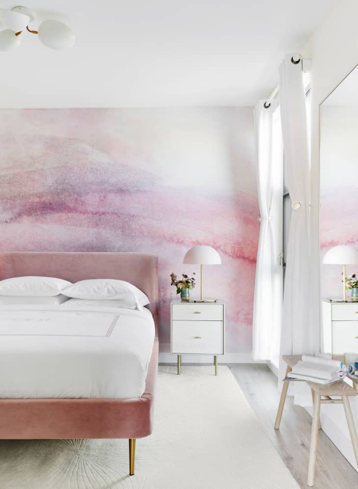 Bright, airy bedroom with pink ombre accent wall
