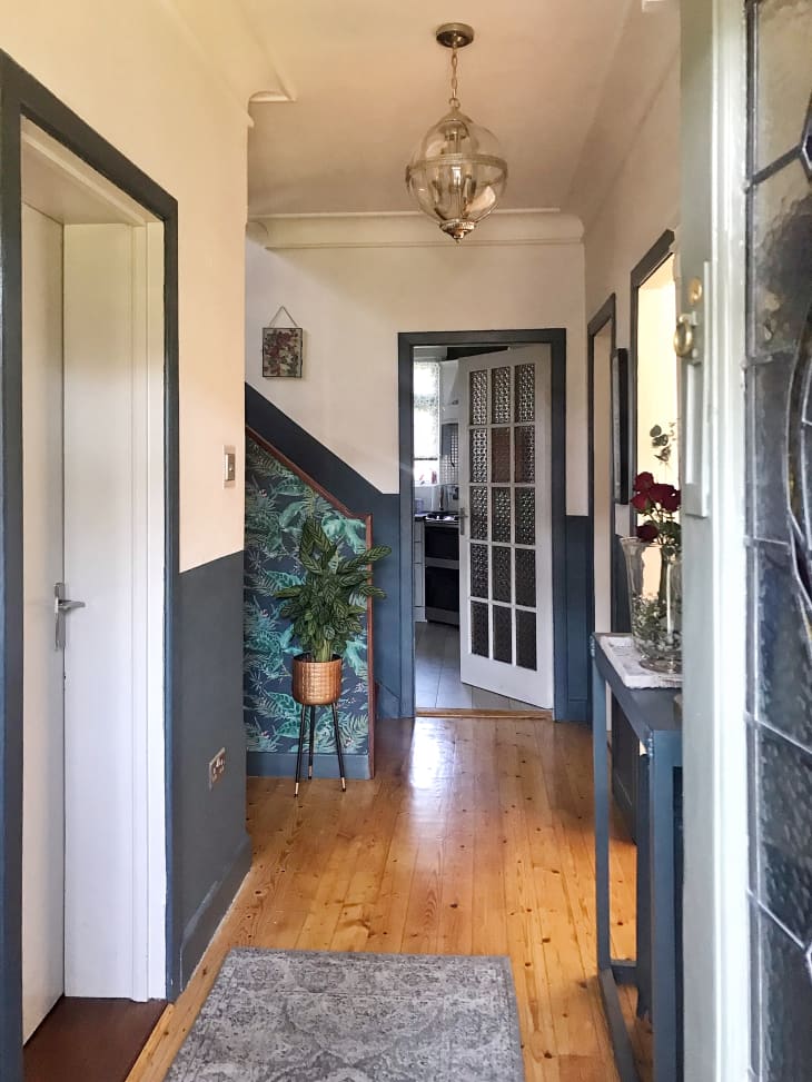 Hallway with gray baseboard and trim