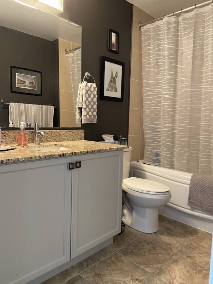 Bathroom with tan tile and countertops and gray walls