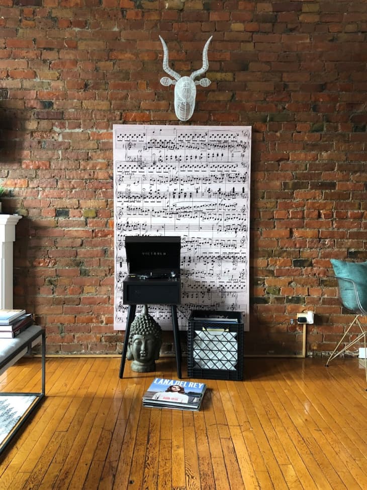 Music listening area with music note art print and record player