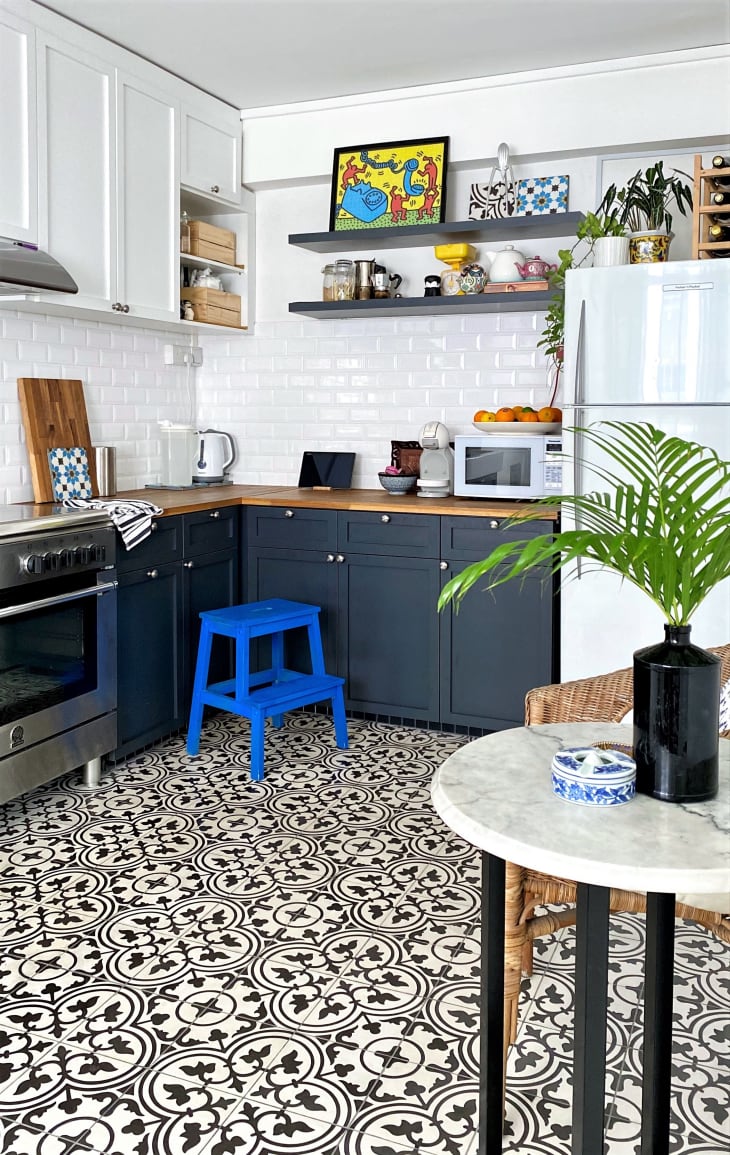 Kitchen with black and white tile floor