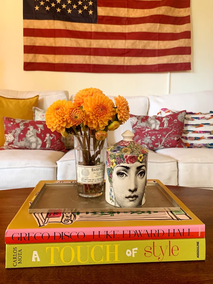 Large books and flowers on coffee table