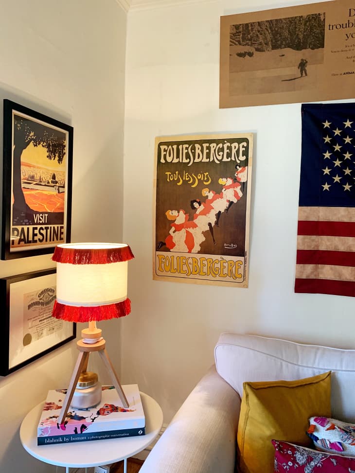Corner of room with vintage posters on wall