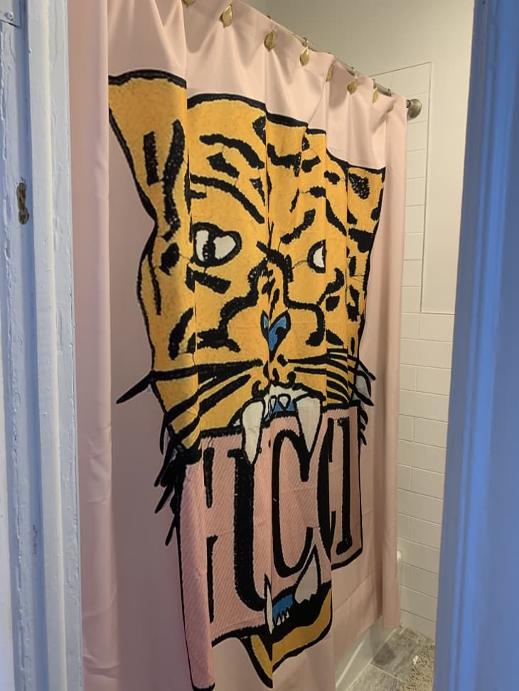 Shower with pink tiger shower curtain