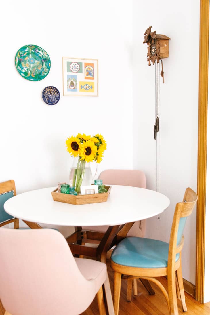 Dining area with sunflowers at center of circular table
