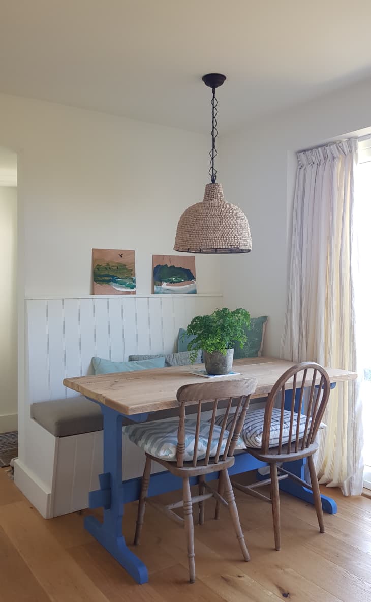 Dining area in kitchen with wicker pendant light