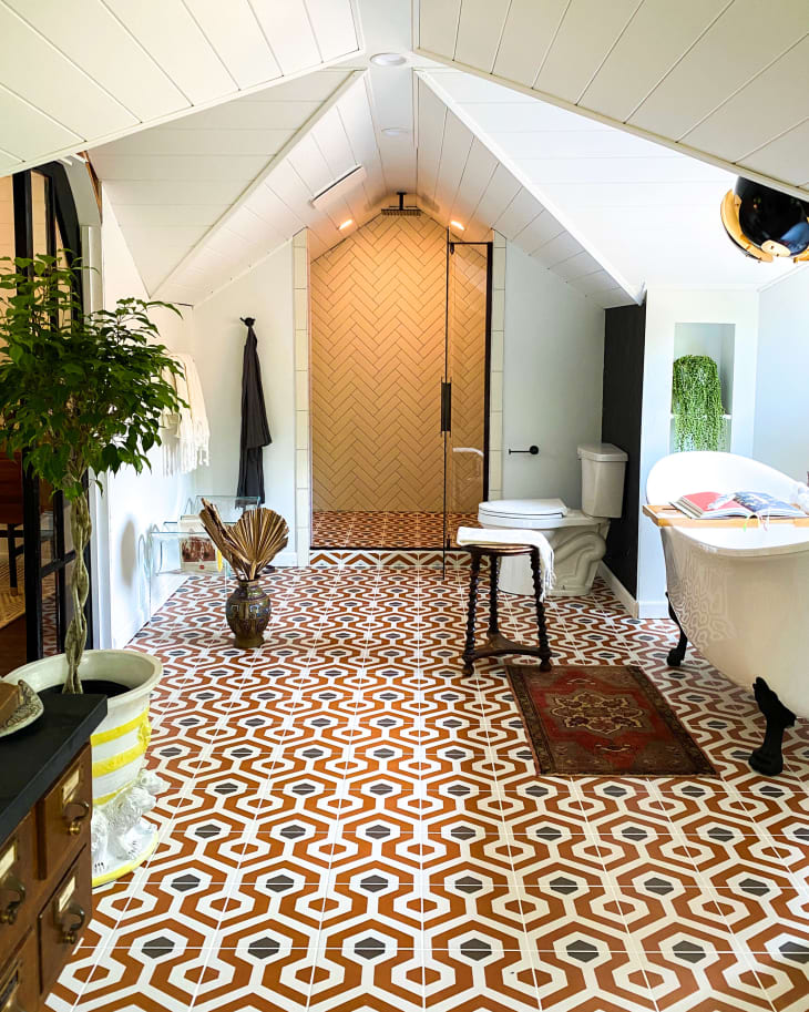 Attic bathroom with clawfoot tub and geometric tile floor