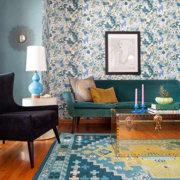 Living room with blue floral wallpaper and teal accents
