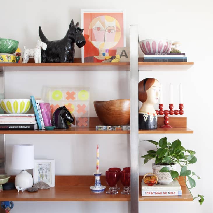 Bookshelf with colorful, whimsical tchotchkes