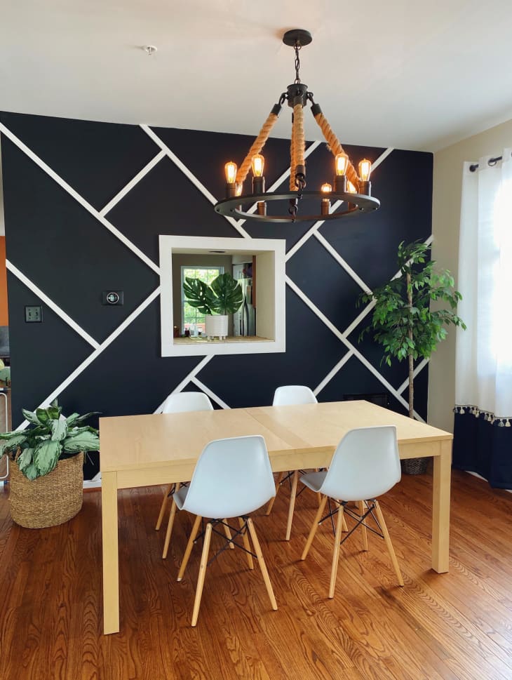 Dining room with black and white rectangle feature wall