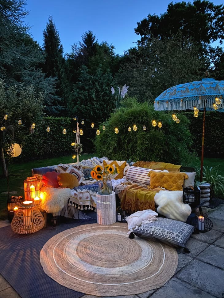 Patio with cozy sectional and string lights