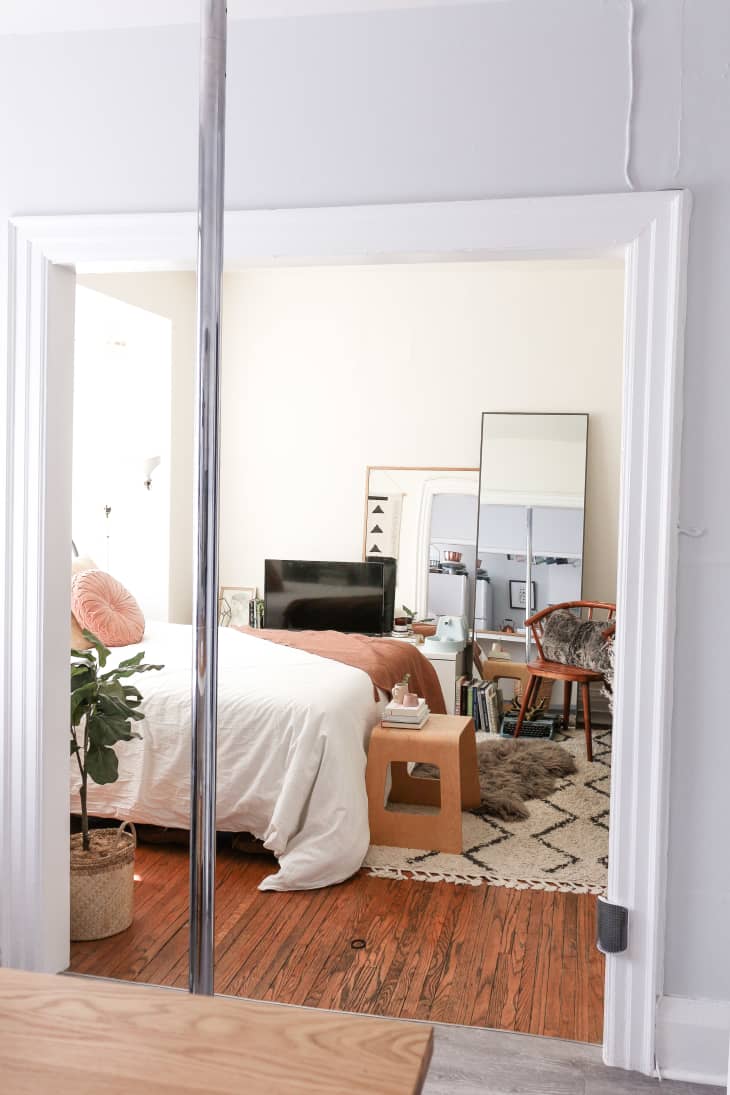 Pole in kitchen with bedroom in background