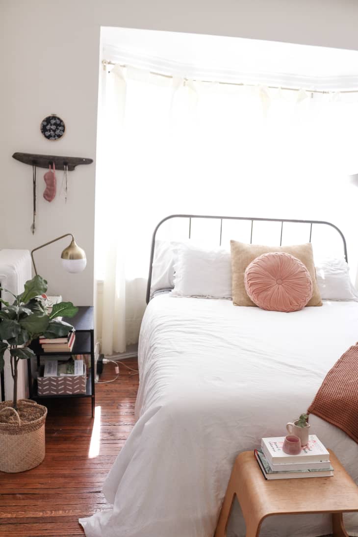 Bedroom with bed in front of window