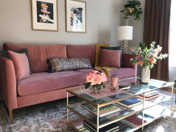 Pink sofa and glass coffee table in living room