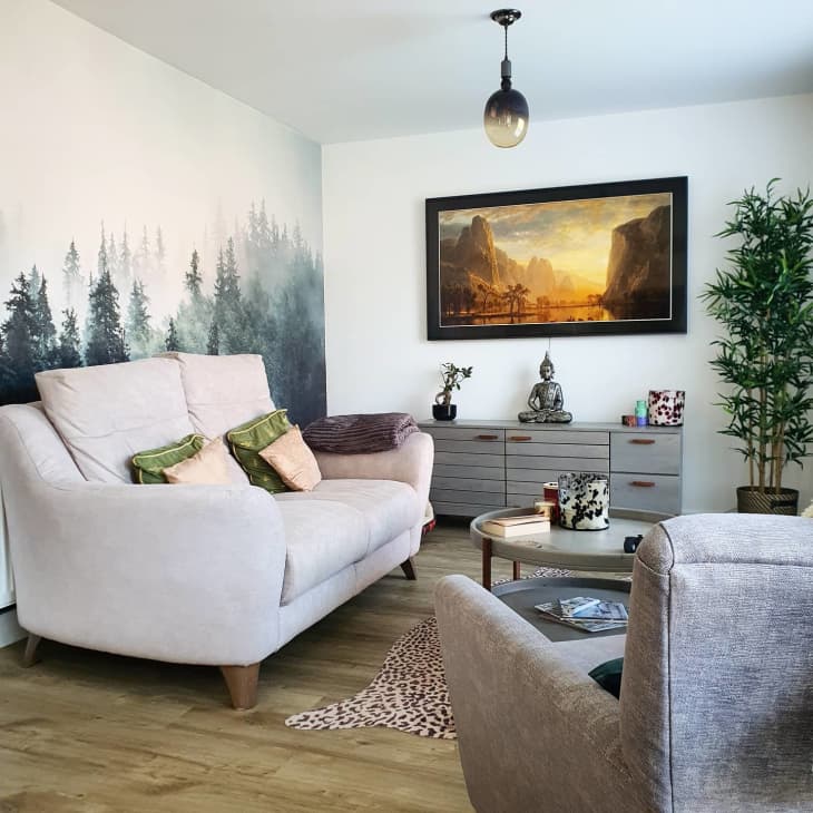 Living room with tree mural feature wall