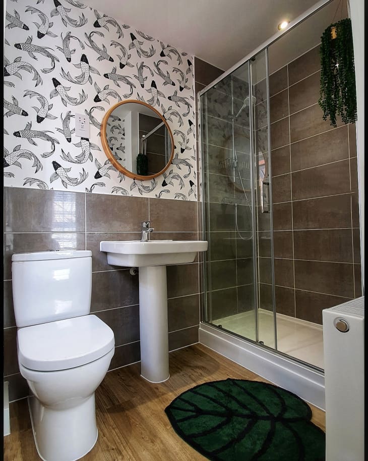 Neutral-toned bathroom with black and white koi fish wallpaper