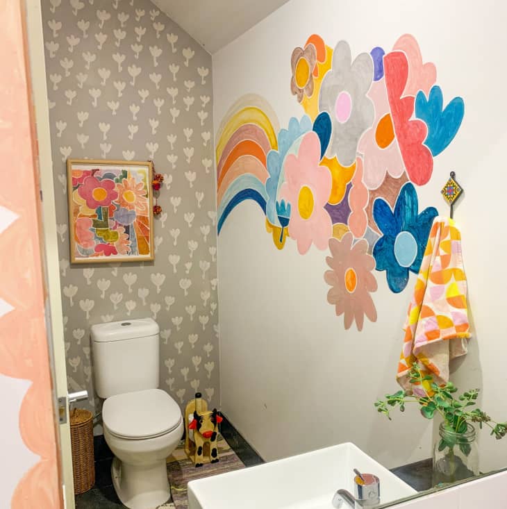 Bathroom with colorful rainbow wall mural