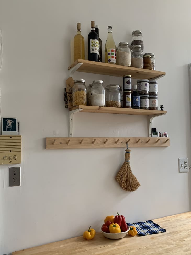 Shelves holding ingredients in kitchen