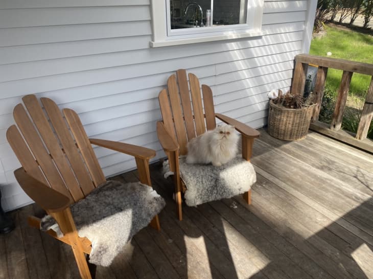 Adirondack chairs on porch outside