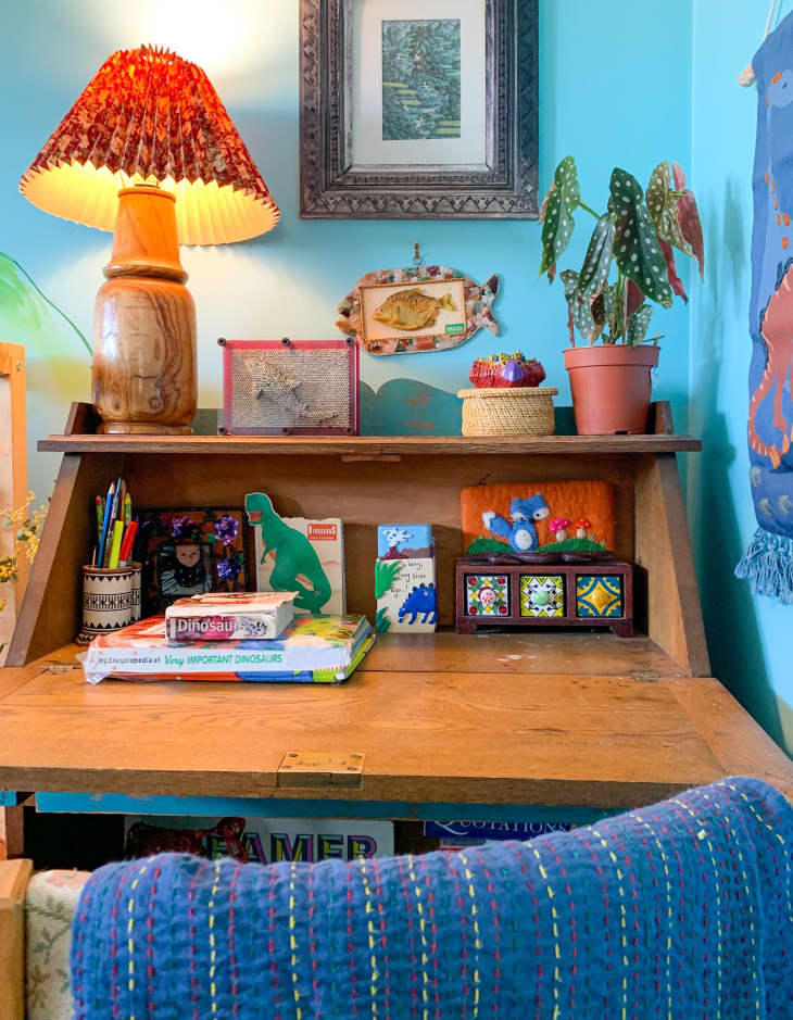 Desk in corner of room with blue walls