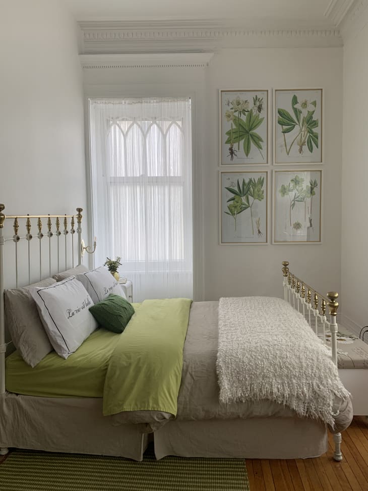 Cozy green, tan, and white bedroom