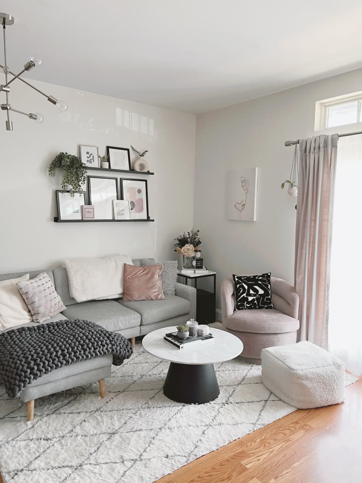 Living room with gray and muted furniture and black and white accents