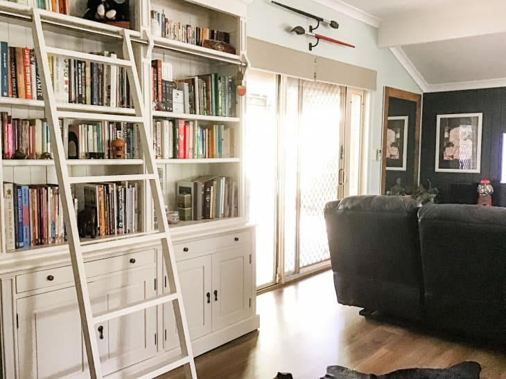 Bookshelf with ladder in living room