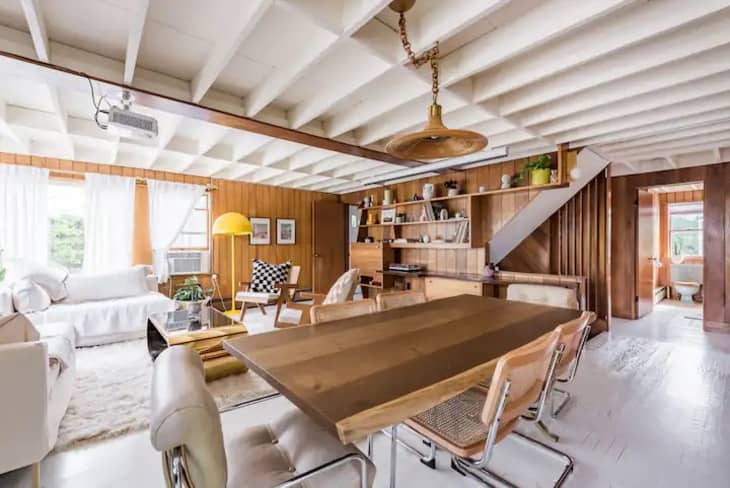 Wood-paneled living and dining areas