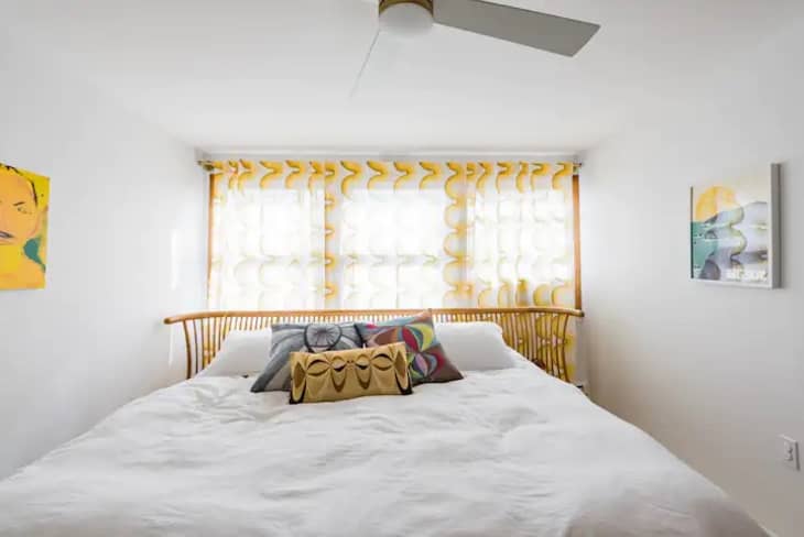 Bedroom with yellow curtains